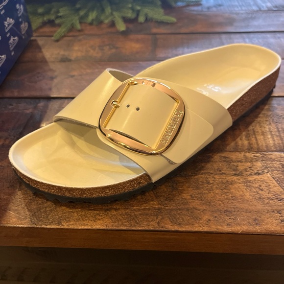 Birkenstock Shoes - Birkenstock Cream Slide Sandals with Gold Buckle